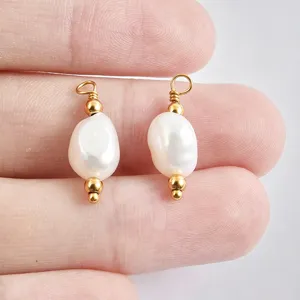 Detailed close-up of baroque natural freshwater pearl charms with gold beads for DIY jewelry.