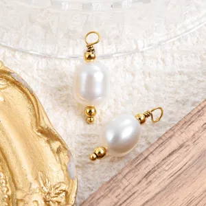 Close-up of baroque natural freshwater pearl pendant with gold pin for DIY jewelry making.