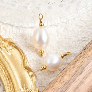 Close-up detail of natural freshwater pearl pendant with gold pin for DIY jewelry making.