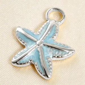 Close-up detail view of the light blue enamel starfish pendant showing fine texture and finish.