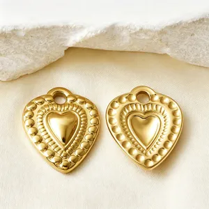 Vintage gold heart pendant detail shot, hollow heart shape DIY jewelry making accessory
