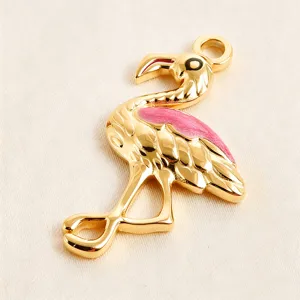 Gold-plated flamingo pendant with pink enamel, ideal for DIY bracelets, necklaces, and chic jewelry.