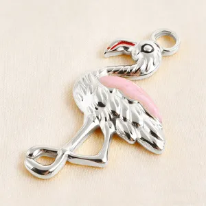 Close-up detail of the metal flamingo pendant with pink enamel, perfect for DIY jewelry.