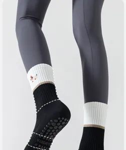 Non-slip yoga socks for women, breathable mid-tube fitness socks with grip soles for pilates.
