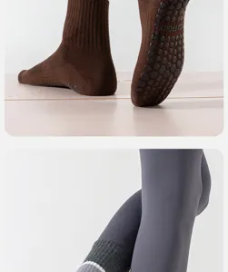 Detail view of women's non-slip yoga grip socks and athletic leggings for pilates fitness.