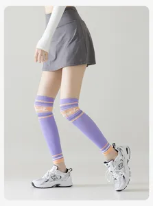 Detailed view of women sports knee compression sleeves with striped design for running yoga fitness.