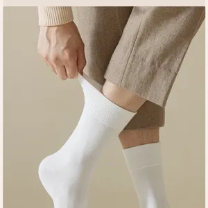 Men's thick thermal white crew socks detail shot showing soft ribbed texture and comfortable fit.