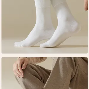 Close-up detail of men's thermal winter crew socks in soft white, cozy and warm texture.