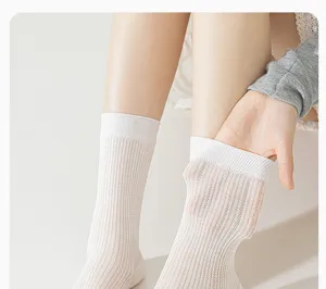 Comfortable white sheer mesh mid-calf socks for women, breathable summer silk style hosiery.