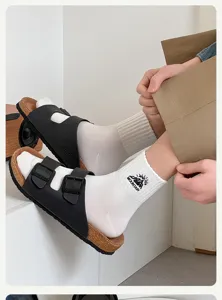 Men cotton mid-tube socks with mountain embroidery, comfortable athletic casual socks detail view.