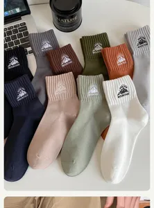 Men's cotton crew socks with stylish mountain embroidery, comfortable and breathable for daily wear.