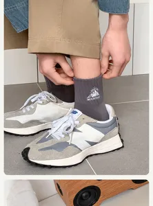 Men's stylish mid-tube cotton socks featuring mountain embroidery for casual daily wear look.