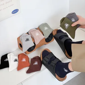 Men's cotton mid-tube socks featuring stylish mountain embroidery, breathable and comfortable.