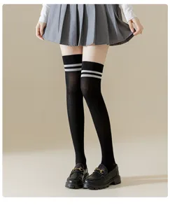 Detailed view of black Japanese style over-the-knee socks with double stripes for women.