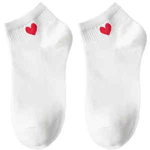 Comfortable white cotton ankle socks featuring a cute red heart embroidery for women.