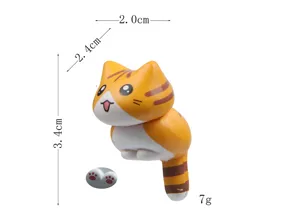 Cute orange cat figurine detail view, miniature desktop ornament with dimension marks.