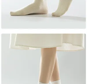 Detailed shot of women white cotton mid-tube socks, showing fine stitching and soft fabric texture.