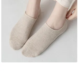 Detail view of shallow invisible boat socks with fine ribbed texture in neutral beige color.