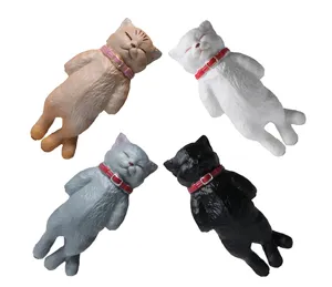 Cute sleeping cat figurine detail shot showing four colorful miniature pet models with collars.