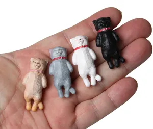 Mini sleeping cat figurines with collars, cute resin charm for DIY keychains and bag pendants.