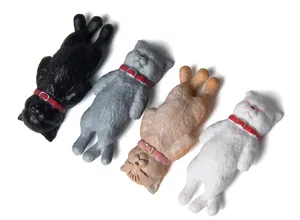 Close-up detail of cute sleeping cat figurines set, miniature resin charms for DIY craft keychains.