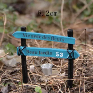 Miniature resin garden signpost ornament with hanging bucket, detailed desktop decor.