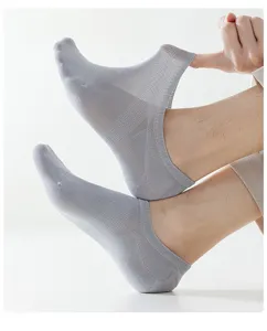 Detail shot of mens summer breathable grey low-cut boat socks with elastic mesh design.