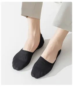 Detailed view of men's black mesh breathable low-cut invisible boat socks for summer use.