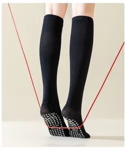 Black compression sports socks for women, anti-slip grip yoga jump rope long calf socks.