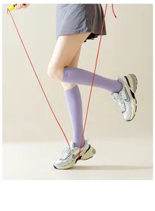 Purple compression calf socks detail view, ideal for fitness, running, and skipping rope.