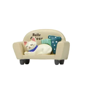 Cute miniature sleeping cat on sofa resin figurine for dollhouse succulent plant decoration.