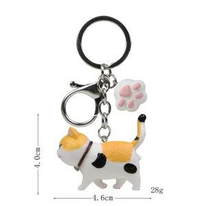 Süßer Glückskatzen-Schlüsselanhänger mit Katzenpfoten-Anhänger, Harz-Figur, 4,6 cm lang.