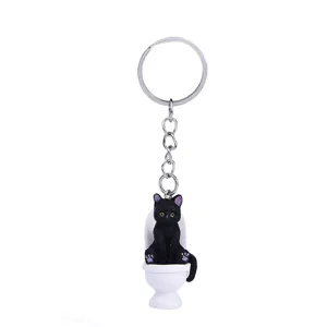 Niedlicher schwarzer Katzen-Toiletten-Schlüsselanhänger, kreative Cartoon-Figur für Tasche.