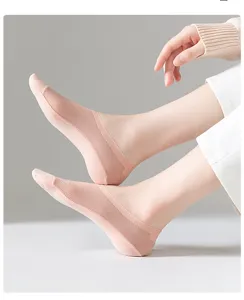 Close-up view of pink shallow cut mesh boat socks worn on foot, showing breathable fabric detail.
