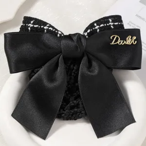 Black tweed bow hair net for women, elegant professional hair accessory for work and office.