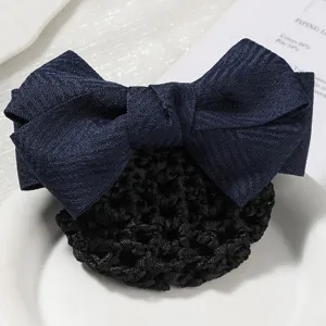 Detailed view of dark blue fabric bow hair net with black mesh pocket for professional wear.