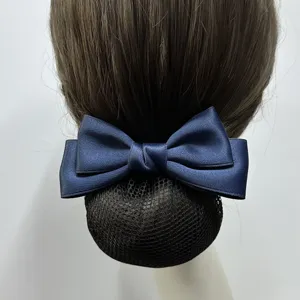 Detail view of a professional dark blue satin bow hair net, perfect for bun styling.