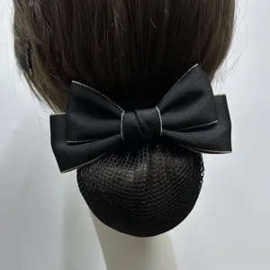 Close-up detail of the black professional hair net bow clip, showing fine mesh and ribbon texture.