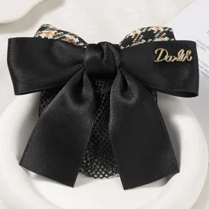 Black satin bow hair net professional work hair accessory with elegant houndstooth design.