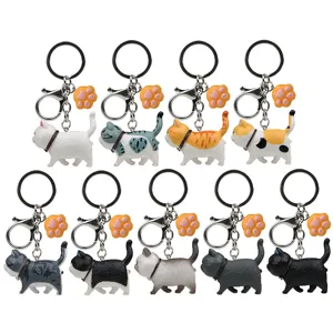 Niedlicher moppeliger Katzen Schlüsselanhänger Set mit Pfoten Anhänger für Taschen und Rucksäcke.