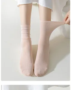 Women solid color mid-tube socks detail, showing soft cotton fabric and great elasticity.