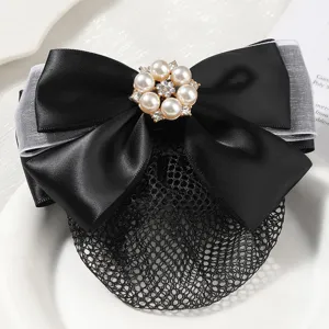 Close-up detail of the black bow hairnet with pearl rhinestone flower, hair accessory.