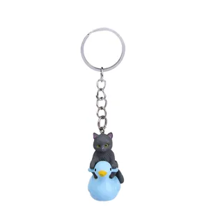 Simpatico gatto grigio che cavalca anatra blu portachiavi cartone animato borsa metallo