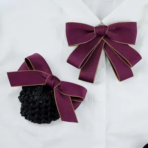 Wine red bow tie and hair net set for professional work uniform, detail view showing texture.