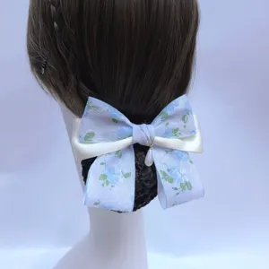 Floral lace hair net bow with white ribbon and pearl pendant for professional workplace use.
