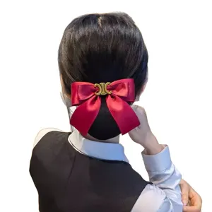 Red satin bow hair net with gold metal logo, elegant bun cover for professional work wear.