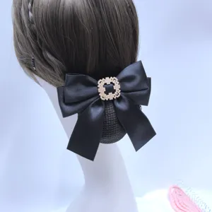 Professional black hair net bow with sparkling rhinestone center, perfect for uniform styling.