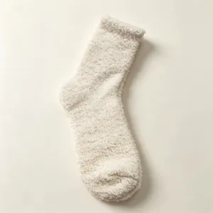 Comfortable cozy beige fuzzy coral fleece mid-calf socks for daily winter warmth wear.