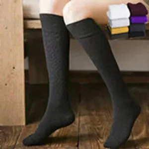 Detail view of solid color over-the-knee long socks, soft knit fabric for comfortable daily wear.