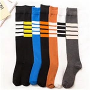 Japanese style knee high socks with striped patterns fashion long socks for women casual wear.